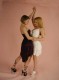 Two hot young blondes dancing together, getting close